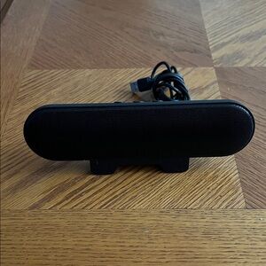 Black USB Speaker. Stand has a clip to attach to monitor, lamp etc 8” x 3”